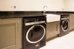Large utility room with washing machine and separate tumble dryer