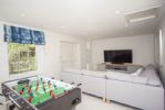 Games room with playstation, table football and comfy seating